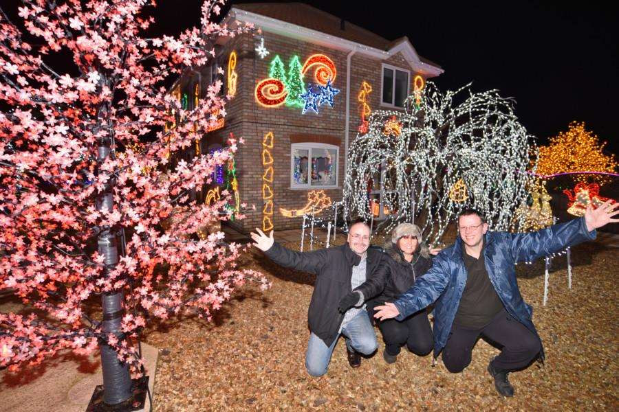 Christmas lights at Duncombes Road, Turves. Robert and Amanda Dempsey with helper Phil Hall EMN-161129-192954009
