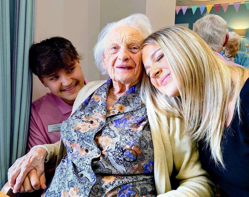 Adrian Biel and Amelia Secker with a resident