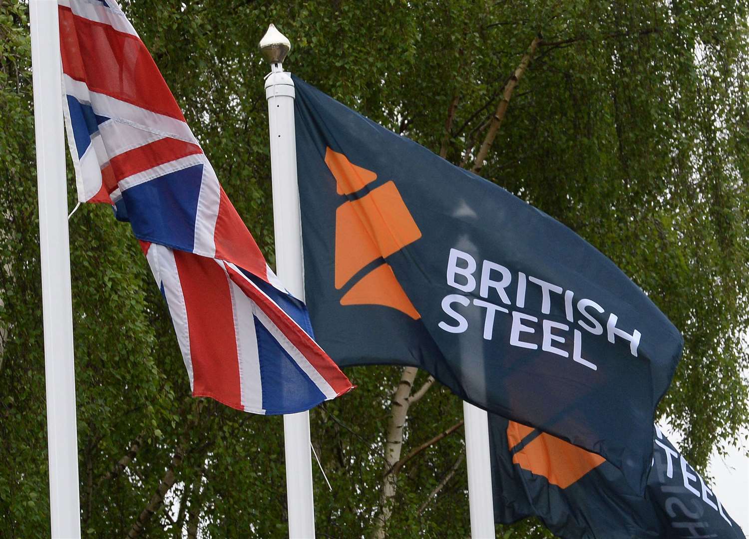 The British Steel logo is displayed on flags (Anna Gowthorpe/PA)