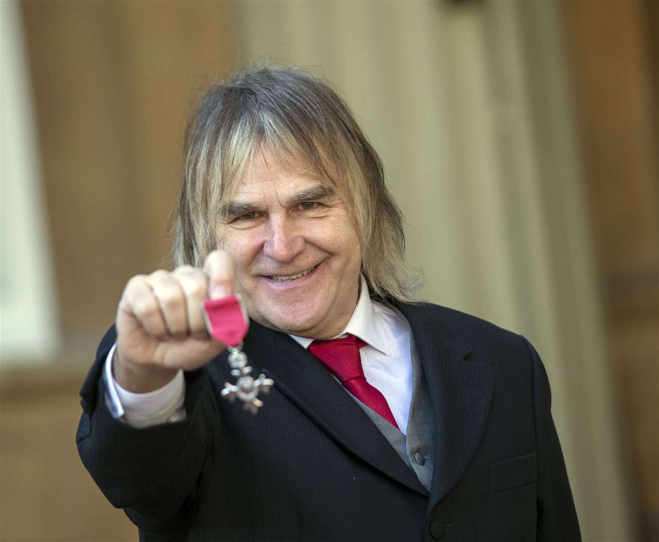 Mike Peters was made an MBE for voluntary services to cancer care in north Wales and abroad (Steve Parsons/PA)
