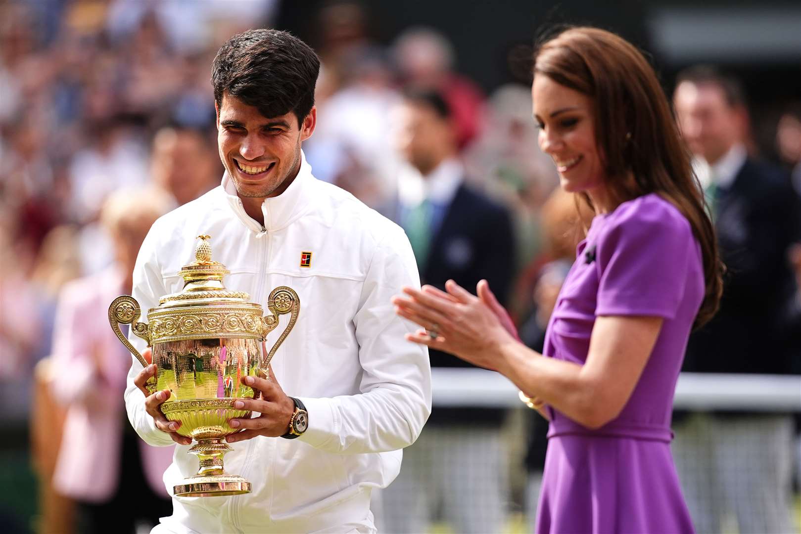 Carlos Alcaraz is presented with the trophy by the Princess of Wales after victory in 2024 (Aaron Chown/PA)