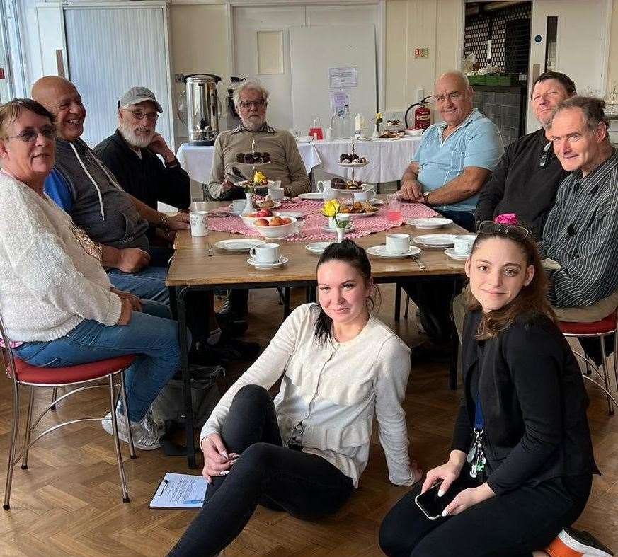 From left around table: Phylis Parrin, Erbie Murat, Ritchie Kitchener, Brian Knowles, Michael Upchurch, Steven Lund and Delvin Smart. On floor: Antonia Dimitrova, receptionist and administrator and Veronika Luoseviciute, project coordinator