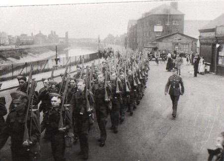 Men of the Cambridgeshire Regiment to which Sapper Pentelow's RE Company was attached marching through Wisbech before departing on manoevres in 1941. Photo: Pentelow family/Wisbech Museum. (55400813)