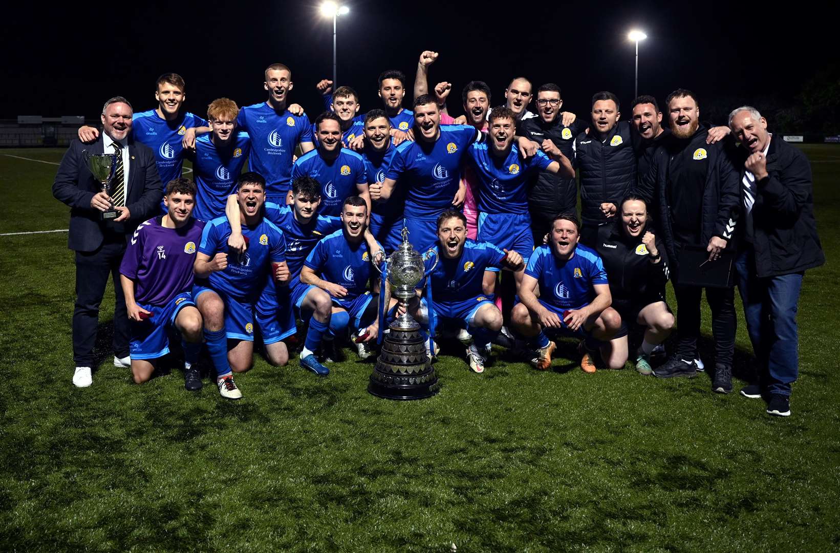 March (Blue) v Blackstones (Green and Black) in the final of the Hinchingbrooke Cup. March celebrate winning the cup