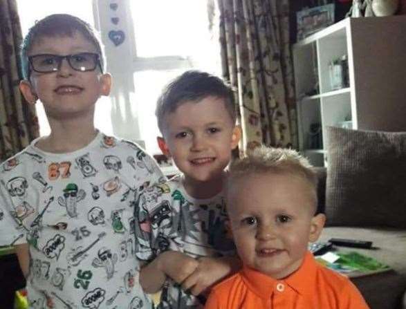 Finley Dodkin, (left), with his brothers Arthur and Harrison (right).
