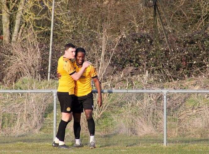 Flo Tsaguim congratulates Craig Gillies on his second goal. Picture Amber Kent