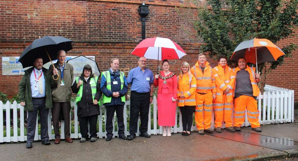 March mayor Kim French officially unveils a memorial garden at the town's railway station to remember war dead.