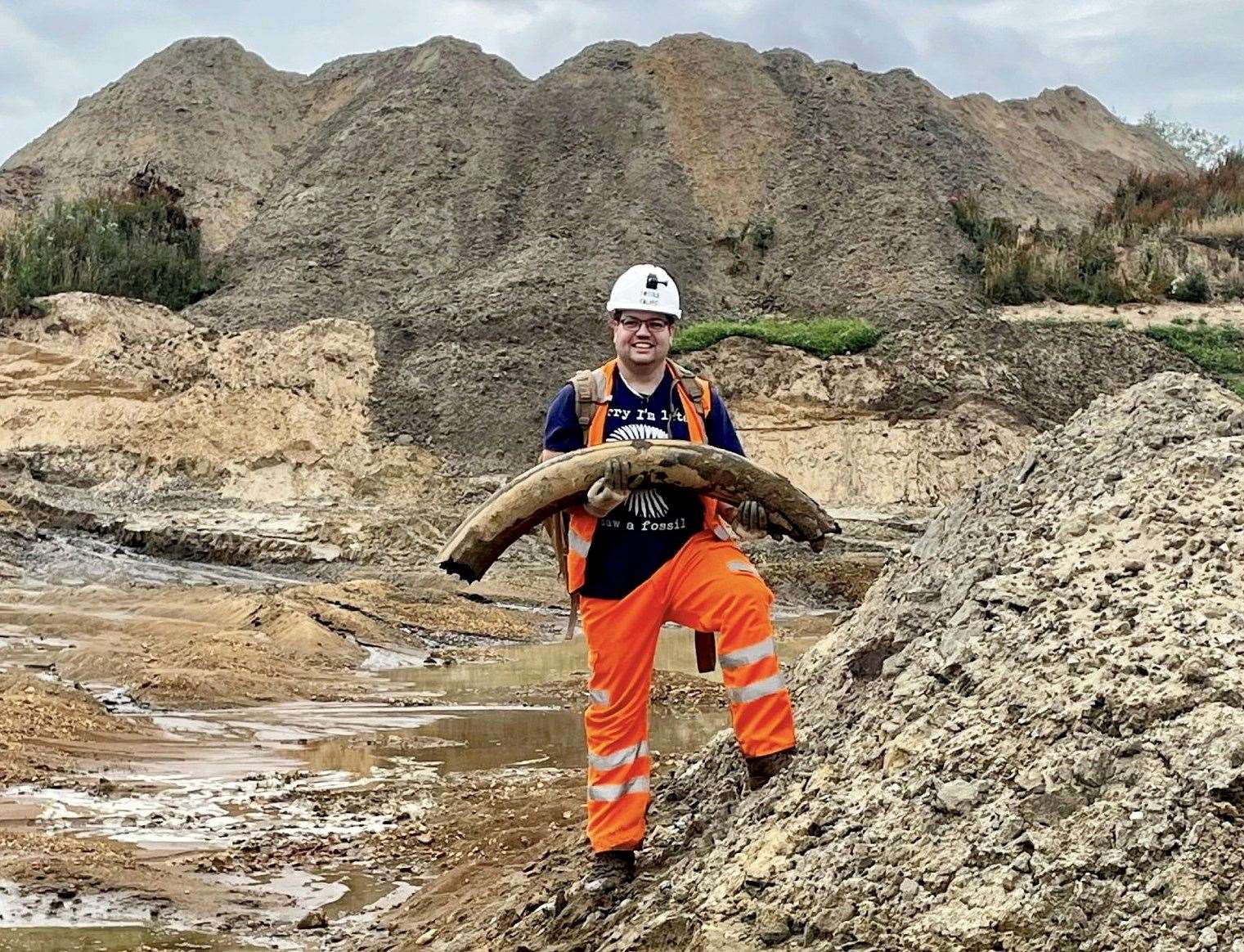 Veteran palaeontologist Jamie Jordan is celebrating a mammoth discover after finding a four-foot-long tusk in a quarry. Photos: SWNS.