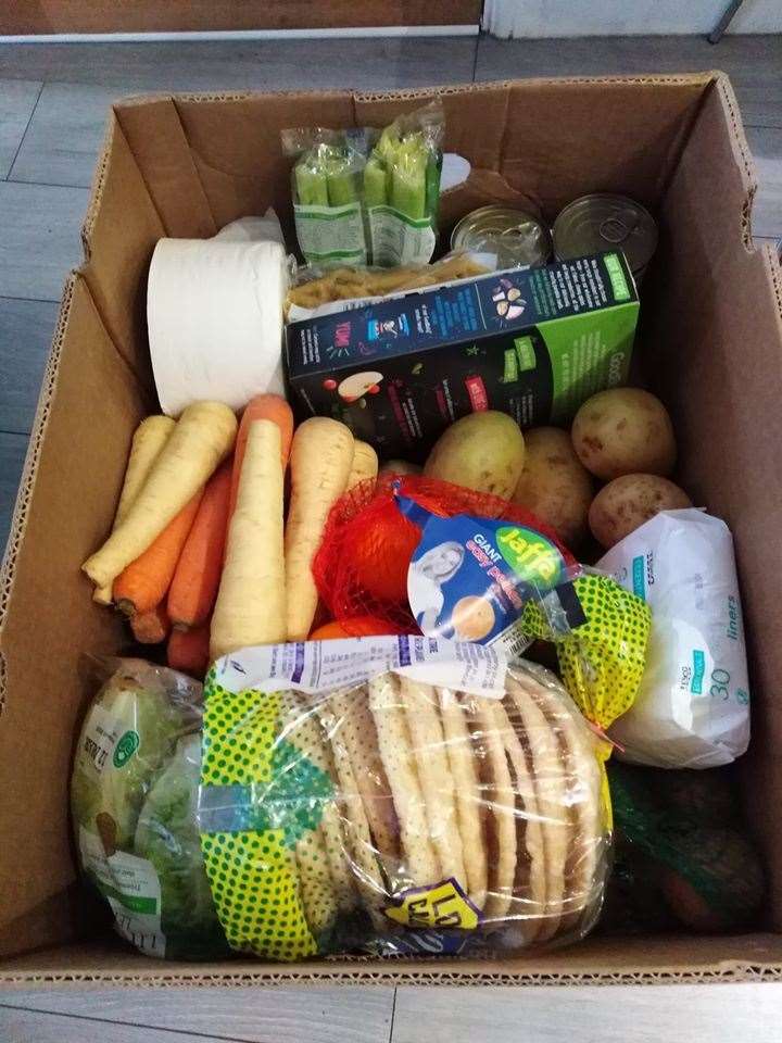 Boxes prepared by 50 Backpacks contain food for a few days and other essentials. (32504770)