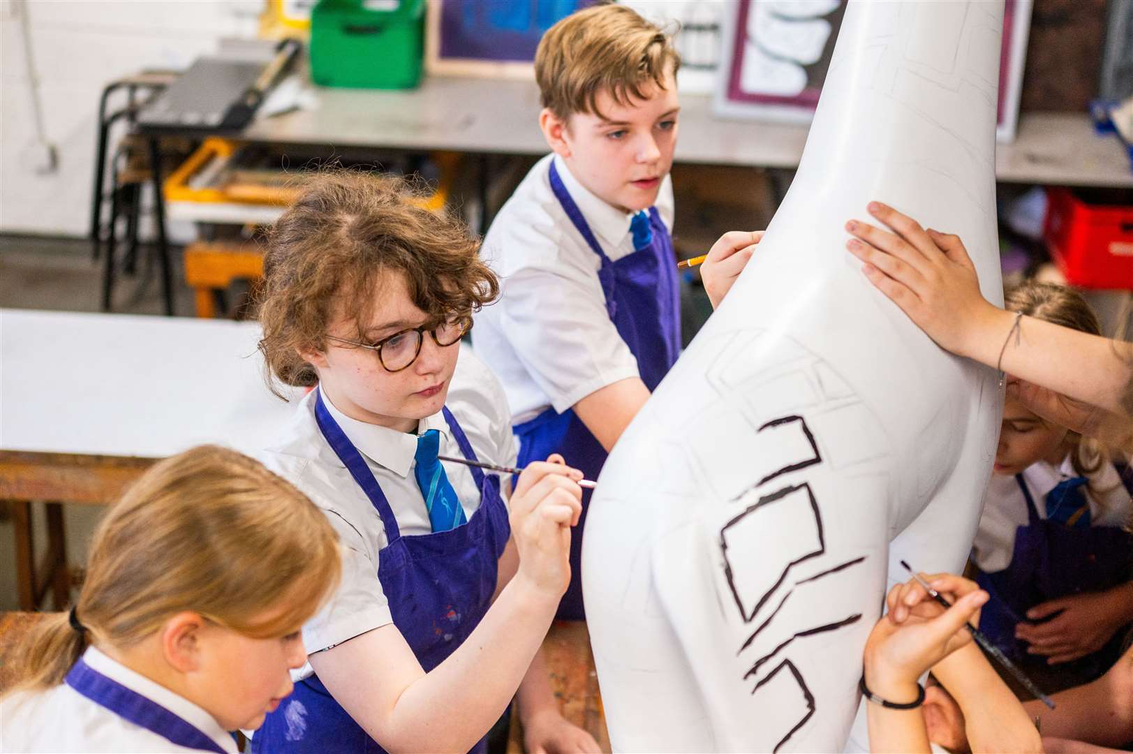 It's not every day you find a giraffe in a rural West Norfolk village, but one has made its home at Marshland High School before taking part in a city art trail next year. Photo: Barking Dog Media/Ian Burt.