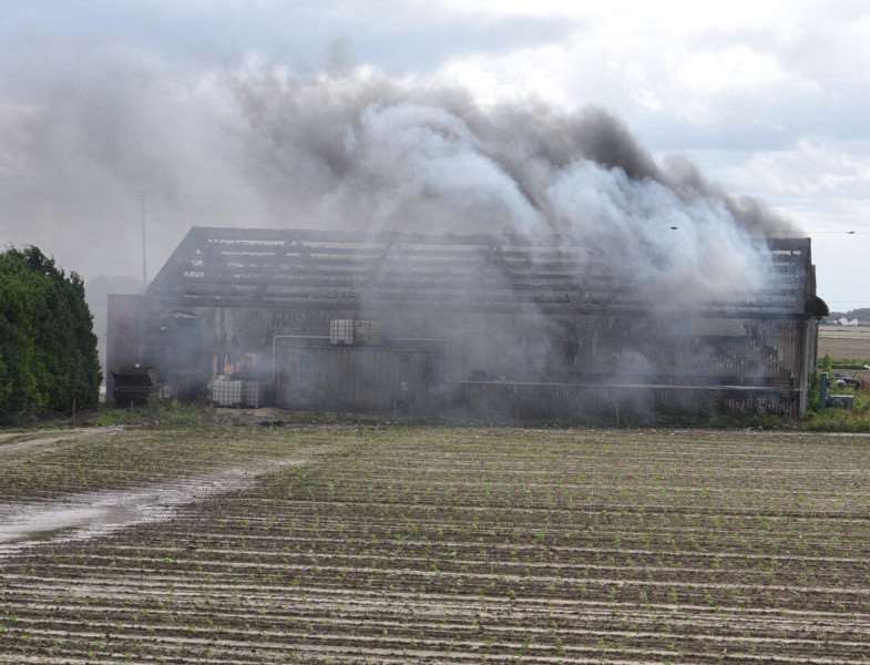 Fire crews tackle a farm fire off South Brink near Wisbech. It sending smoke billowing across the A47 causing problems for drivers.