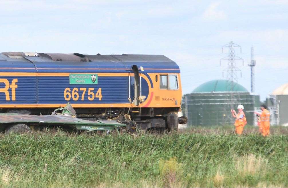 Network Rail staff work to clear the track at March on the day of the crash