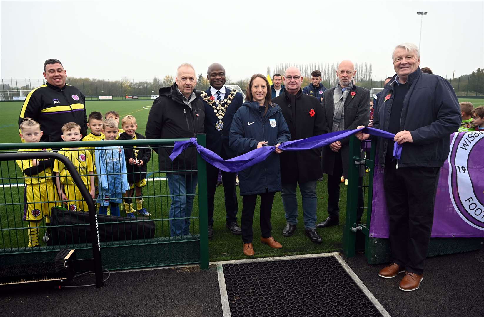 Official opening of Wisbech St Mary's 3G pitch by Katie Critchley of Cambs FA - she cut the ribbon watched by Martin Holmes and Paul Albutt, and the Mayor of Wisbech Sidney Imafidon.