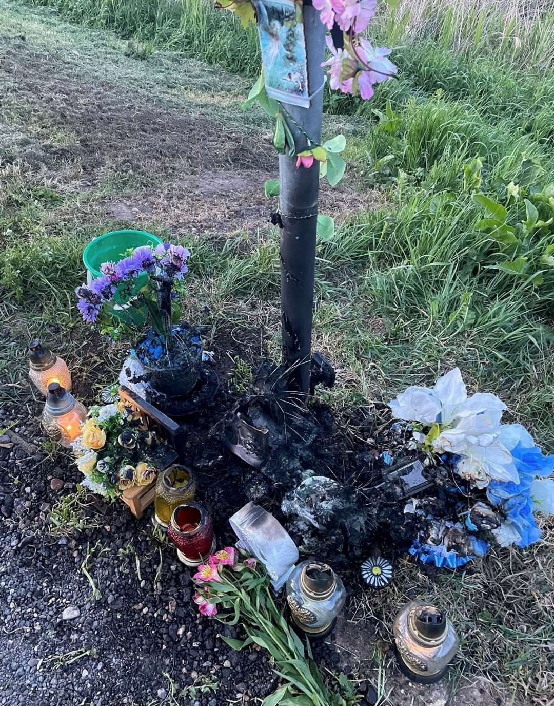 Flowers and other tribute items were burnt