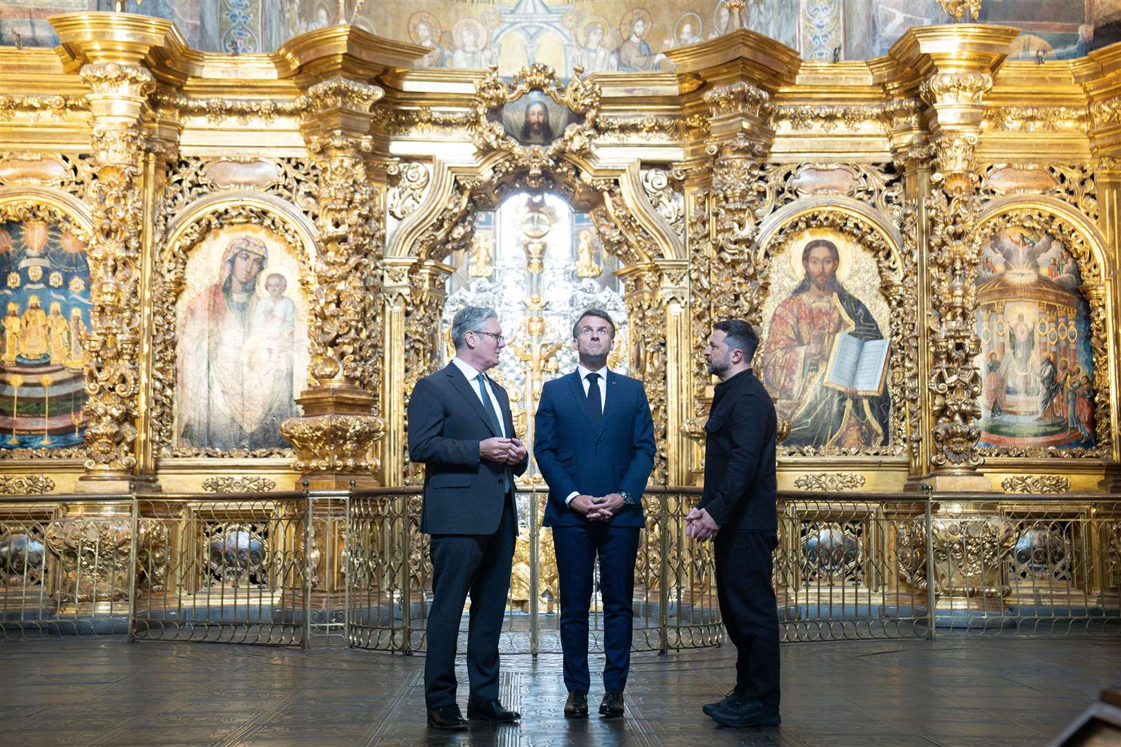 Prime Minister Sir Keir Starmer, French President Emmanuel Macron and Ukrainian President Volodymyr Zelensky visit St Sophia Cathedral in Kyiv (Stefan Rousseau/PA)