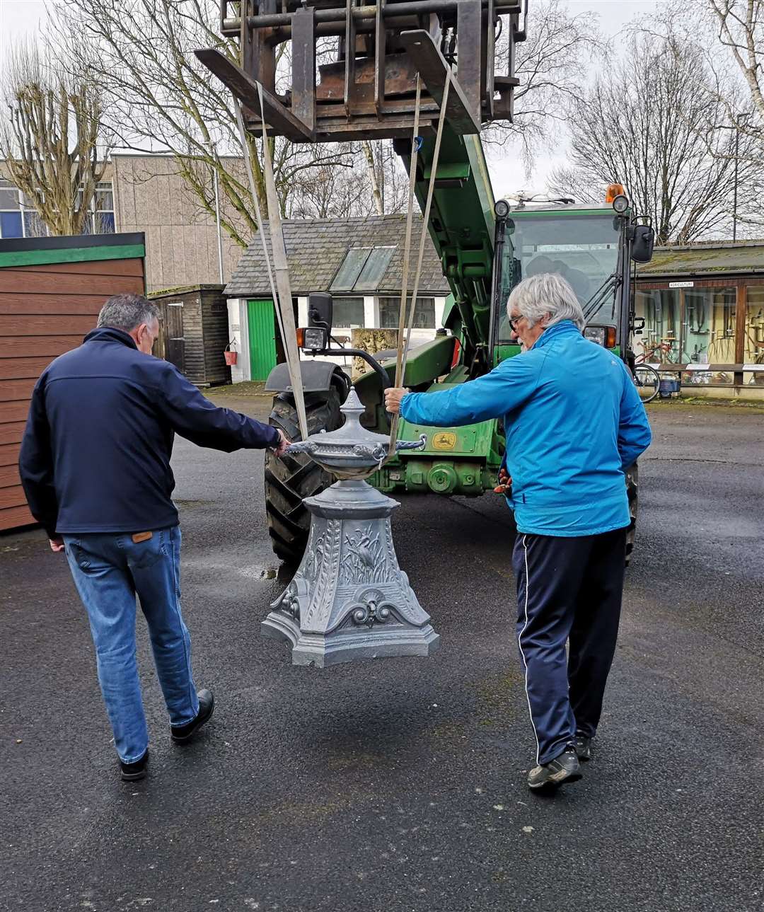 The top of the drinking fountain was too heavy to carried so mechanical assistance was needed