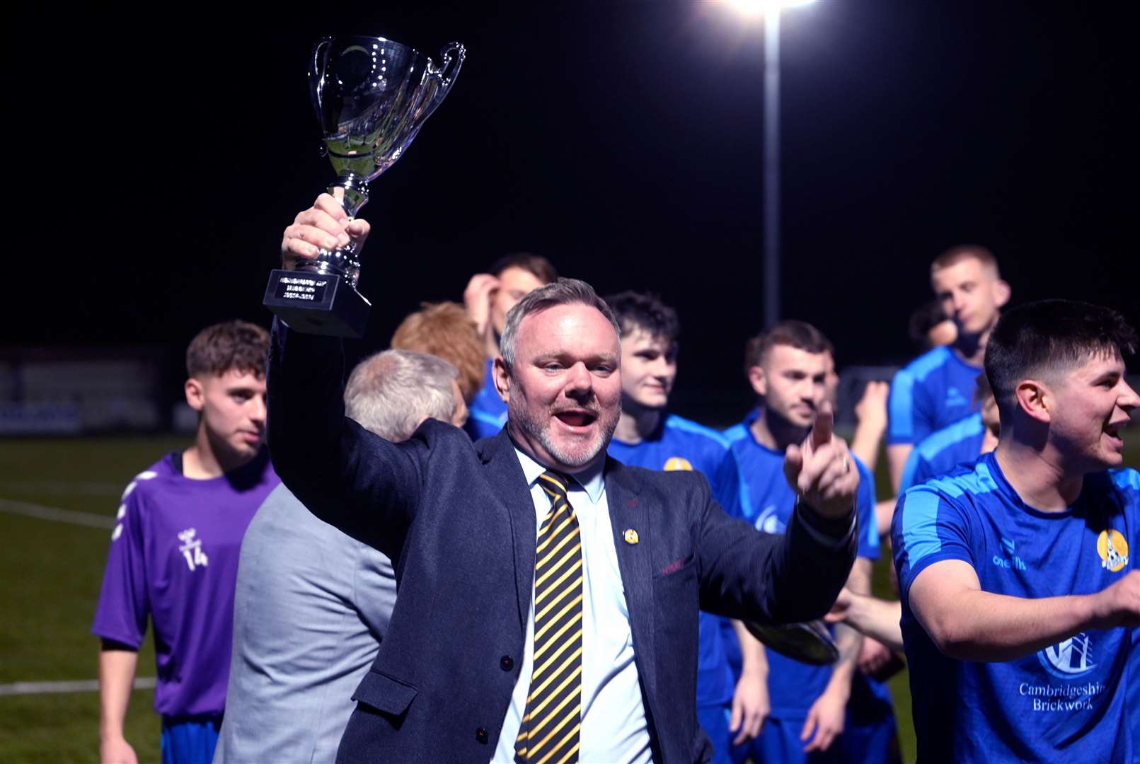 March (Blue) v Blackstones (Green and Black) in the final of the Hinchingbrooke Cup. March celebrate winning the cup