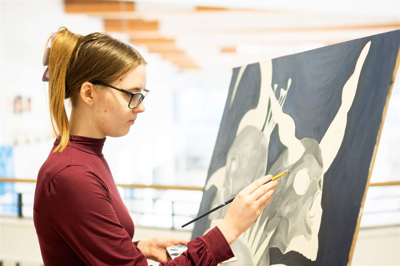 Monika at work at the easel. Photo: Barking Dog Media/Ian Burt.