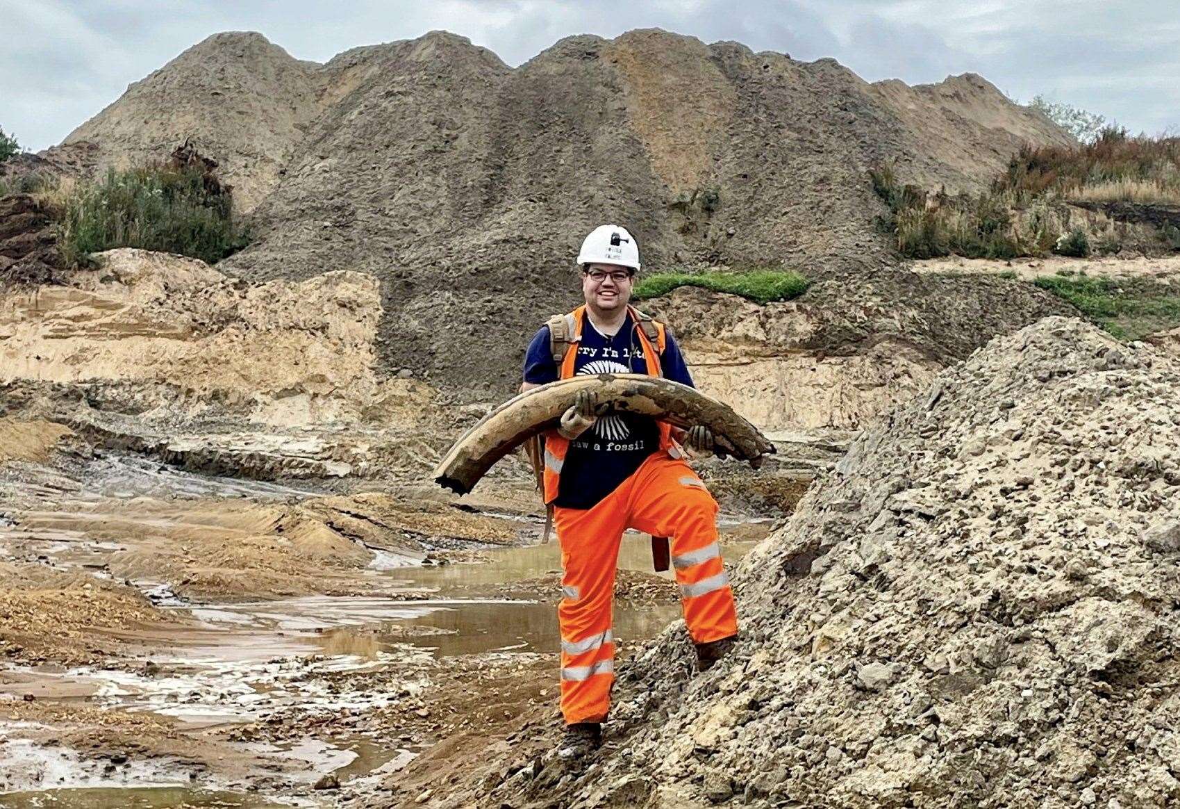 Veteran palaeontologist Jamie Jordan with the mammoth tusk found in a quarry which will be on display this summer. Photos: SWNS.