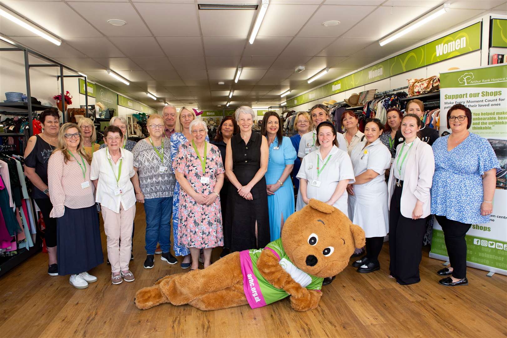Carol West (pink dress) opens the new Arthur Rank Hospice Charity Shop in March with the CEO Sharon Allen, the Nurses who cared for her husband, Geroge, the new Shop Manager, Louise Frary, Area Manager, Laura Denney and the Matron from the Alan Hudson Centre, Michelle Knight and the Hospice at Home Matron, Emma Bratby.