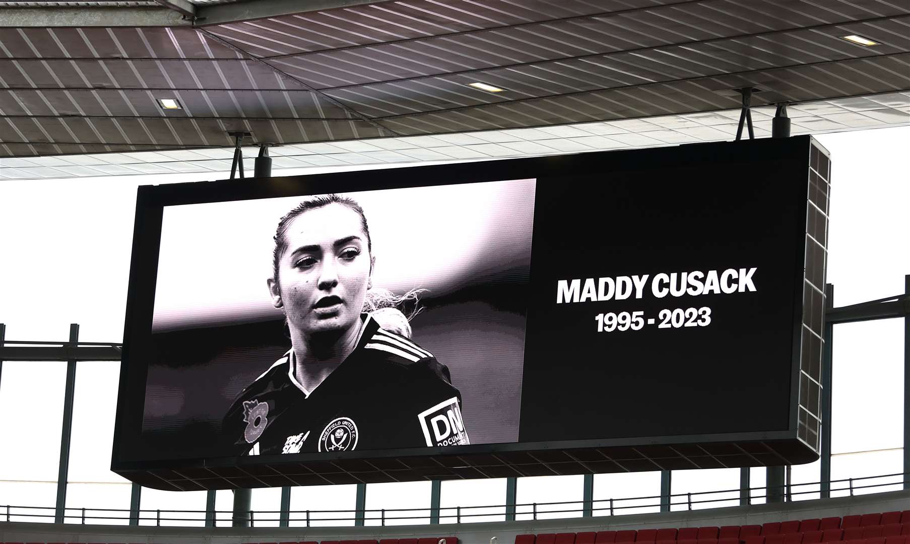 A tribute to Sheffield United player Maddy Cusack is shown on the big screen during the Barclays Women’s Super League match at Emirates Stadium, London (Steven Paston/PA)