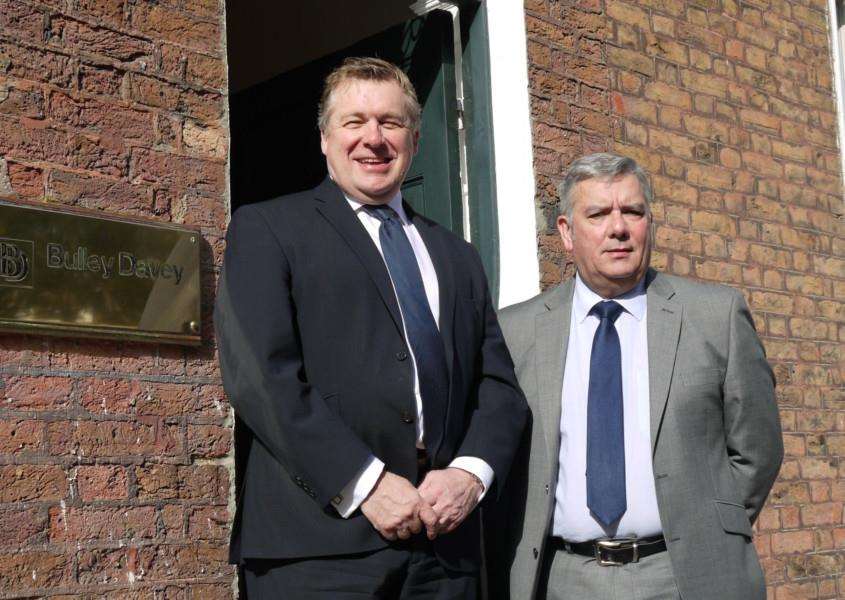 Steve Fisher and John Anker pictured out the front of the Bulley Davey office on The Crescent, Wisbech.