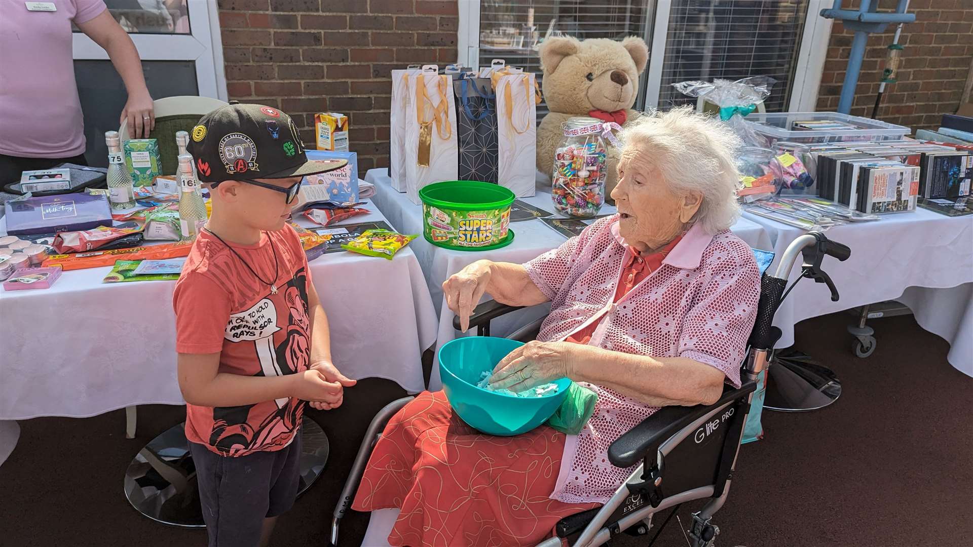 Betty manning one of the many stalls with a young visitor.