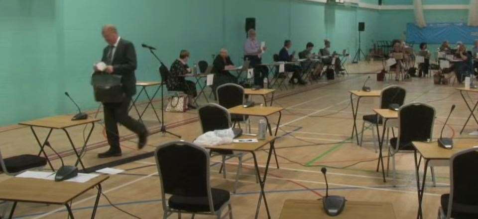 Steve Count exits tje full county council meeting past the empty chairs of his fellow Tories who also walked out following a row at Tuesday's meeting. (49507820)
