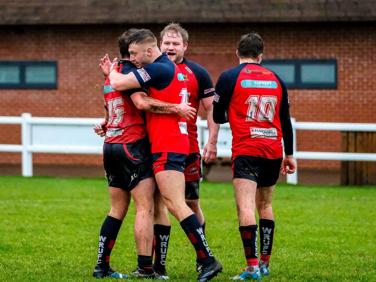 Wing Hal Whyatt is mobbed by team mates after scoring a crucial try against Wymondham. Picture: Andy Titmuss