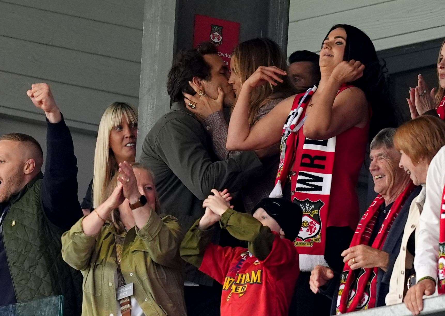 Ryan Reynolds celebrated with a kiss with his wife Blake Lively after Wrexham scored their first goal (Martin Rickett/PA)