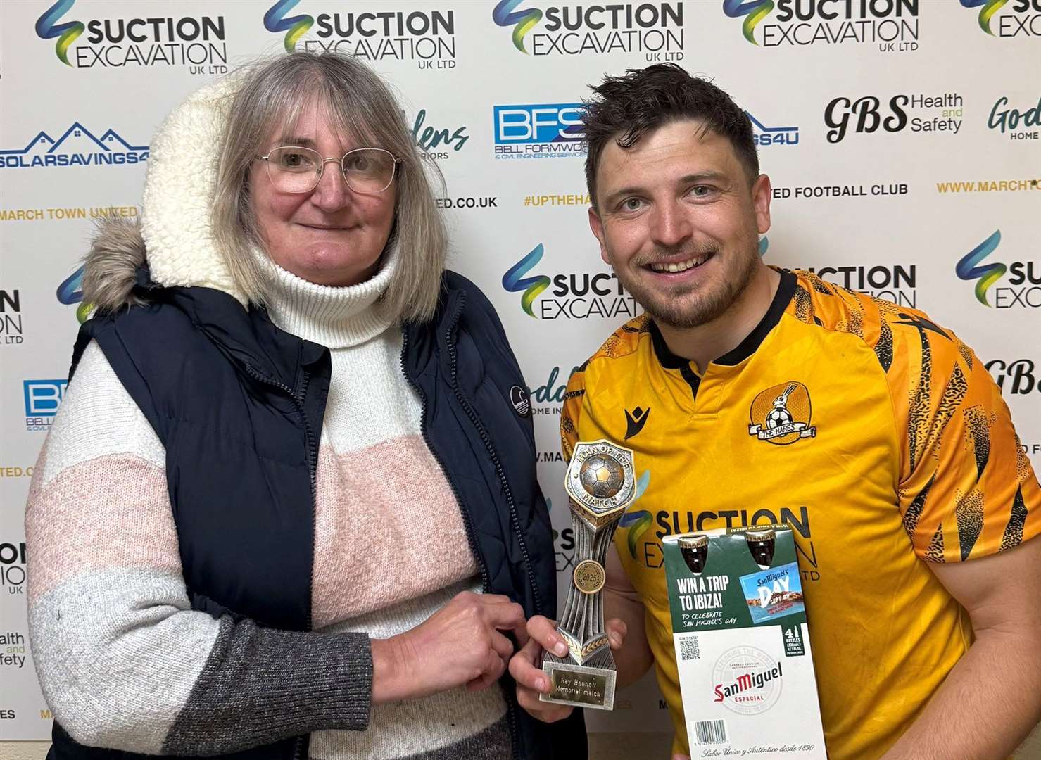 Danny Emmington receives his man of the match award from the match sponsor, the family of former club treasurer Ray Bennett