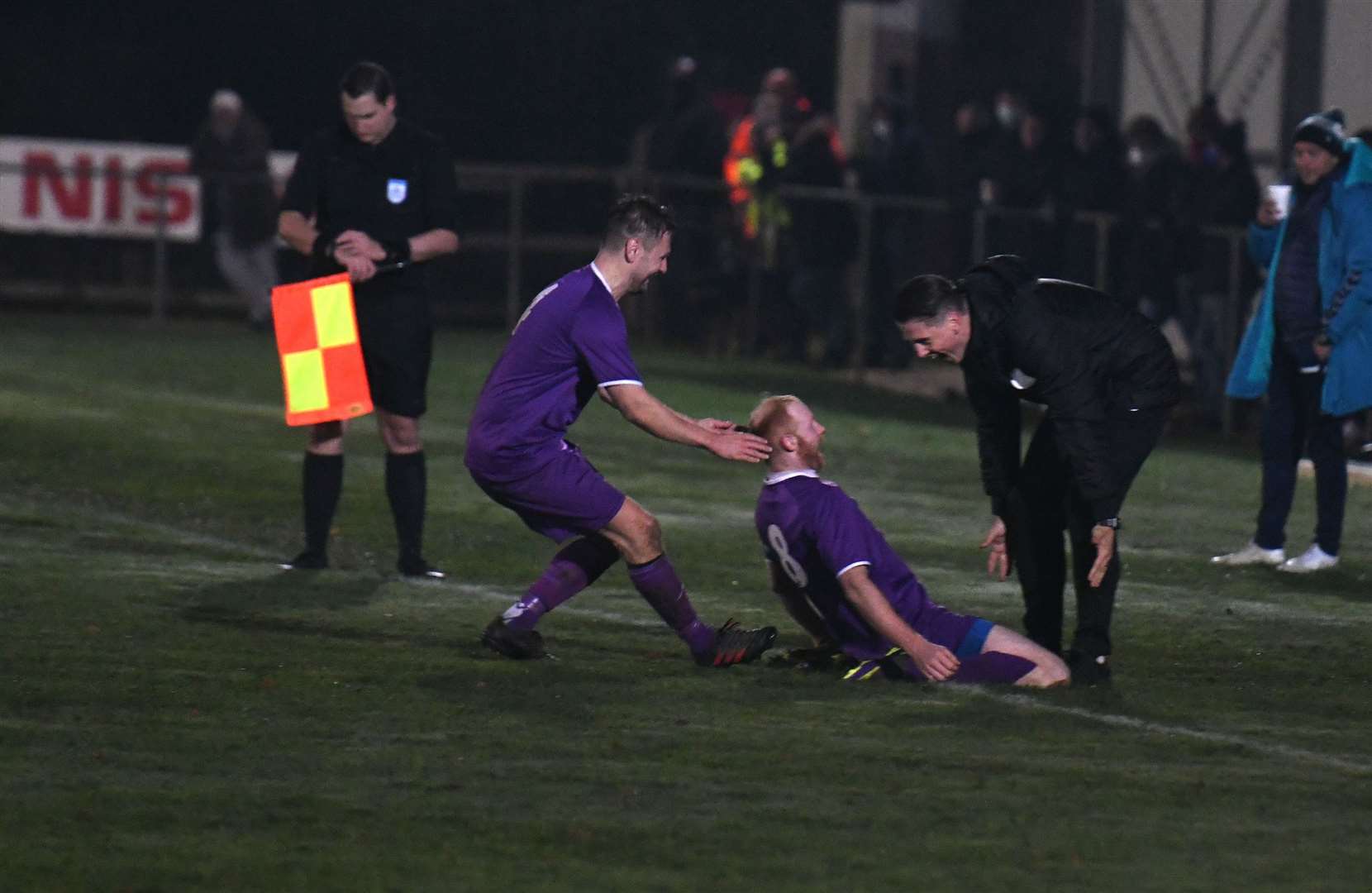 David Weaver-Pope celebrates his goal with Wisbech St Mary manager Stuart Beckett.