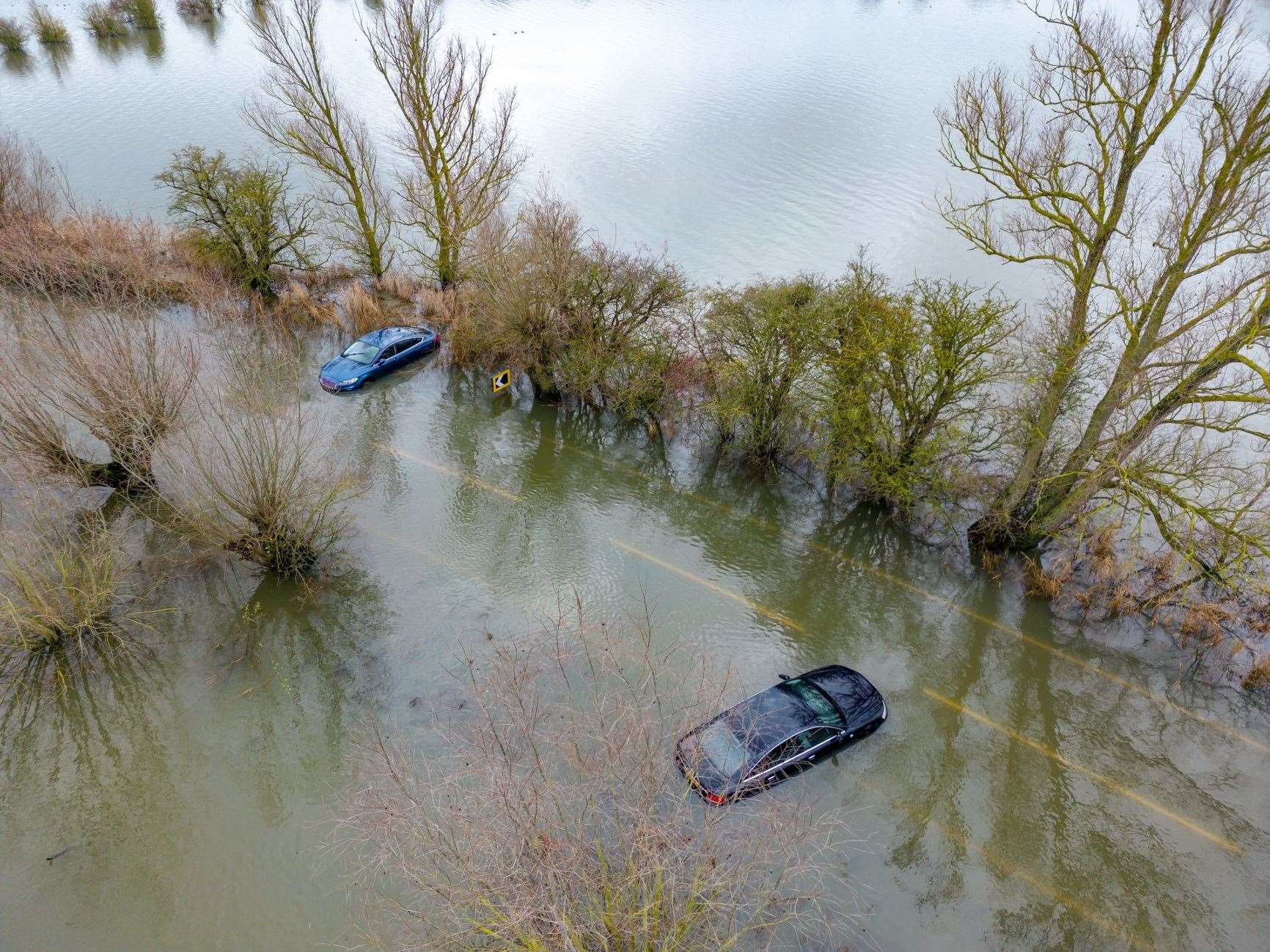 Cars stuck in the flood water at Welney Causeway. Picture: Ian Burt