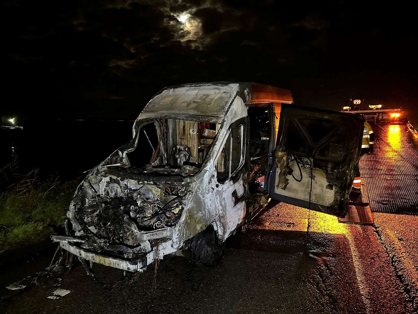 The charred remains of the delivery van