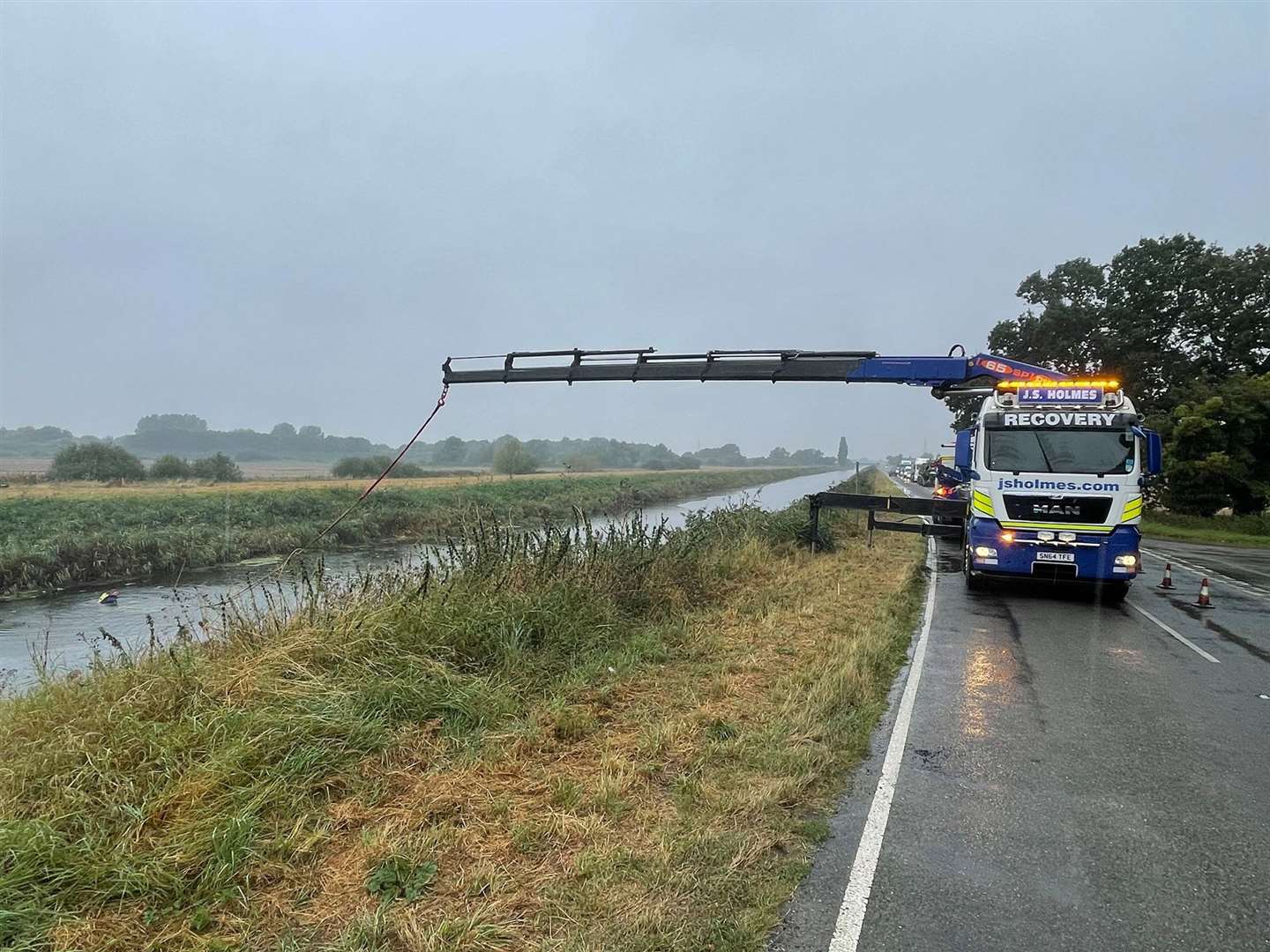 Police and emergency services worked to remove a vehicle from a Fenland river. (51222204)