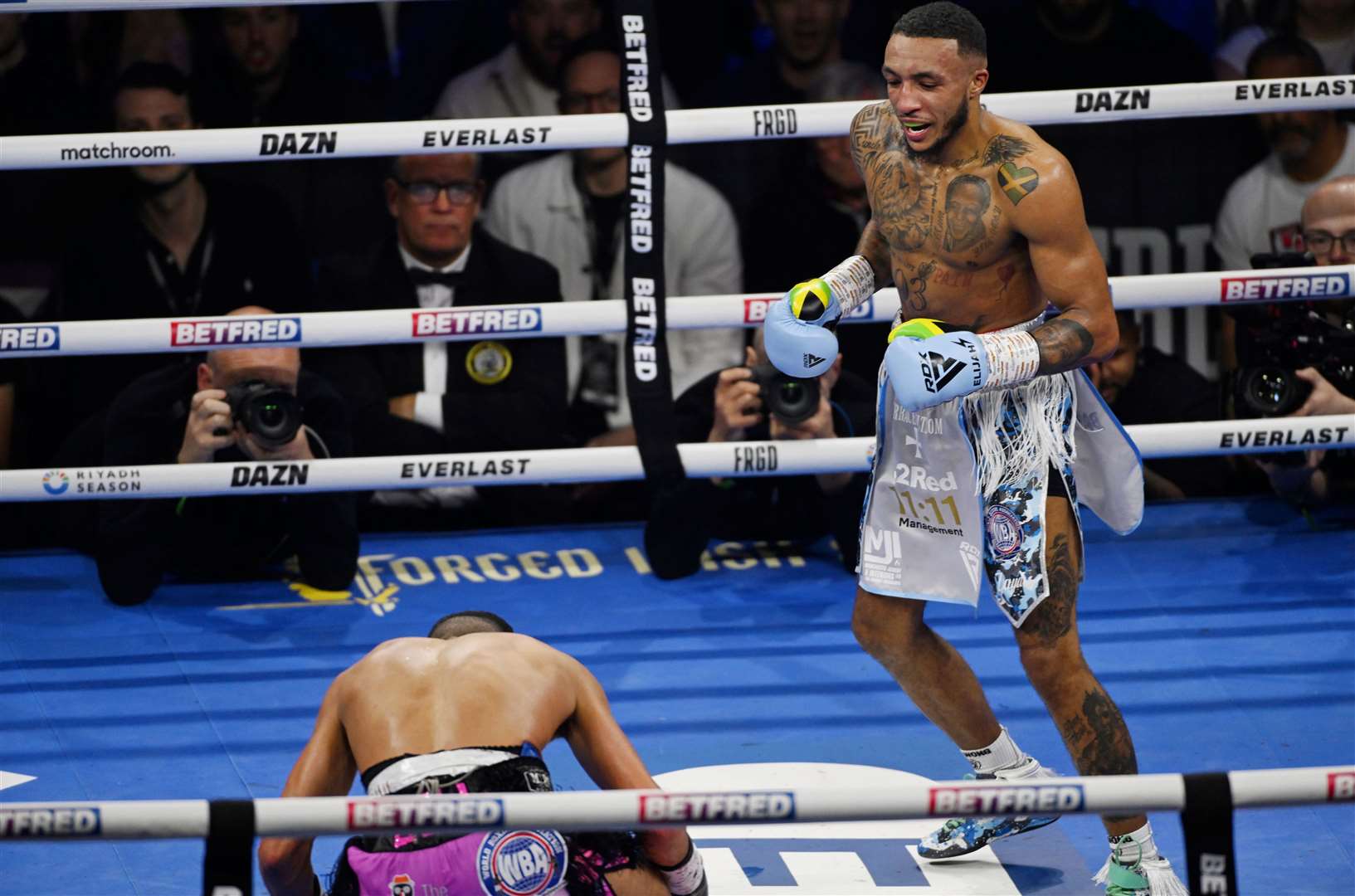Barrett knocks Gill down. Picture: Matthew Pover (Matchroom Boxing)