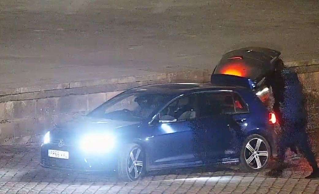 The men bundled the 18-carat-gold toilet into the back of a blue VW Golf (Thames Valley Police/PA)
