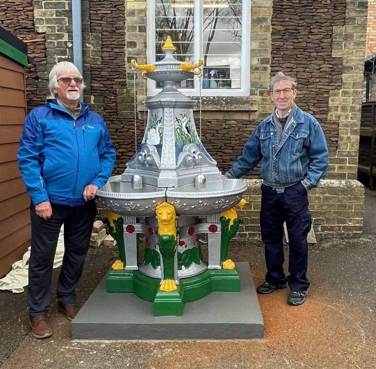 David Bates (left) and Kelvin Adams have been working on restoring the centrepiece for more than three months