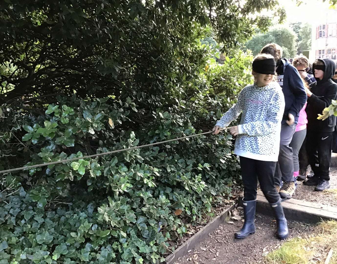 Children tried a variety of activities including wearing a blindfold.