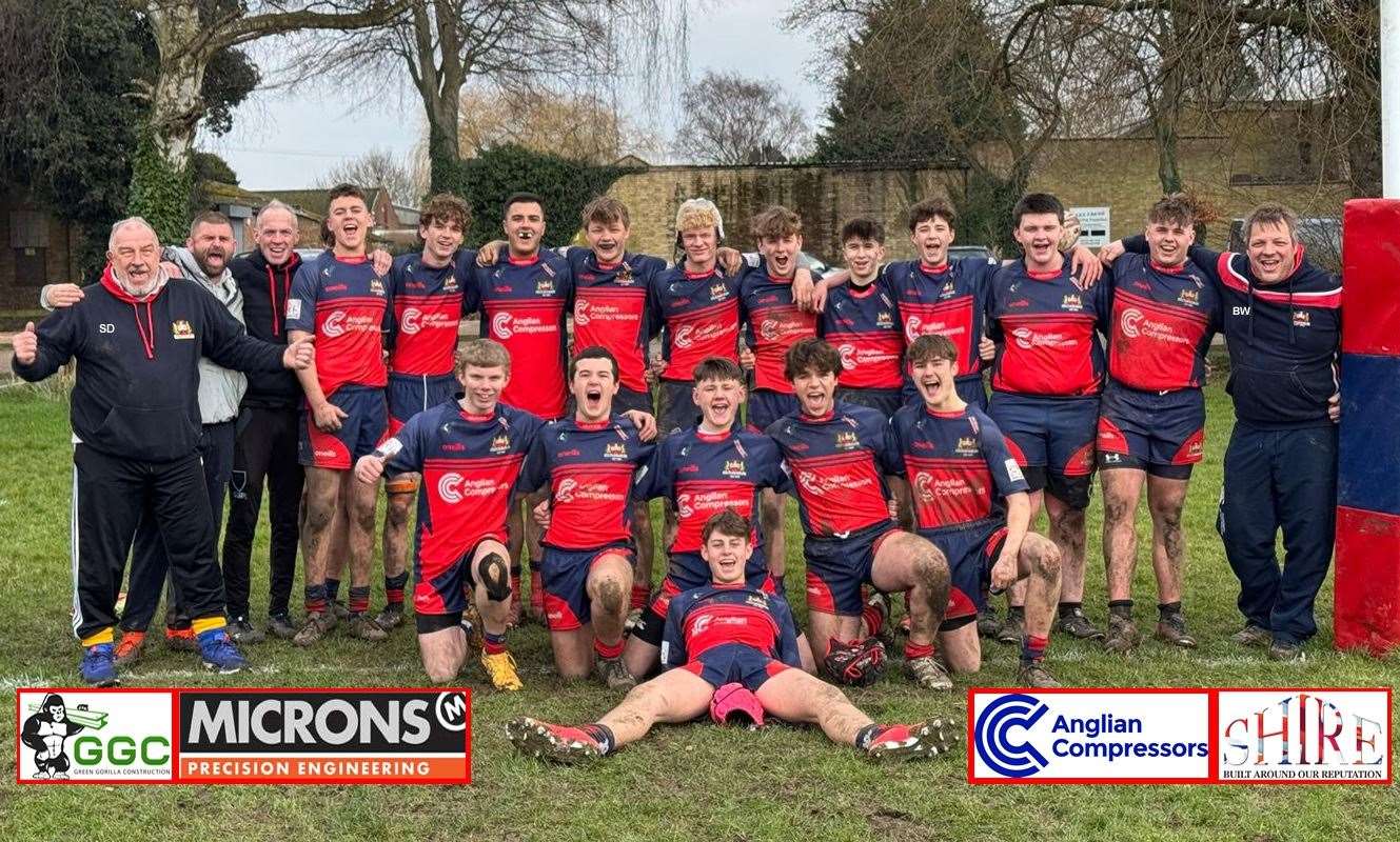 A jubilant Wisbech U16s face the camera after their County Cup win against Shelford.