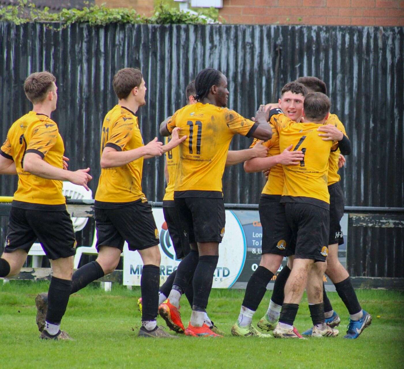 March Town players congratulate James Moore after the striker scored his first goal for the club in a 3-0 victory against Yaxley on Easter Monday. Picture: Amber Kent
