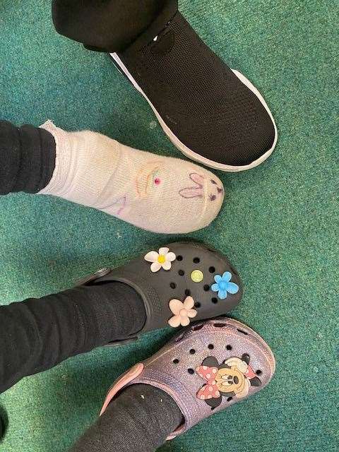 Pictured are Year 5 children who led an assembly and organised a walk to school week poetry writing competition plus some of the fancy footwear that was worn.
