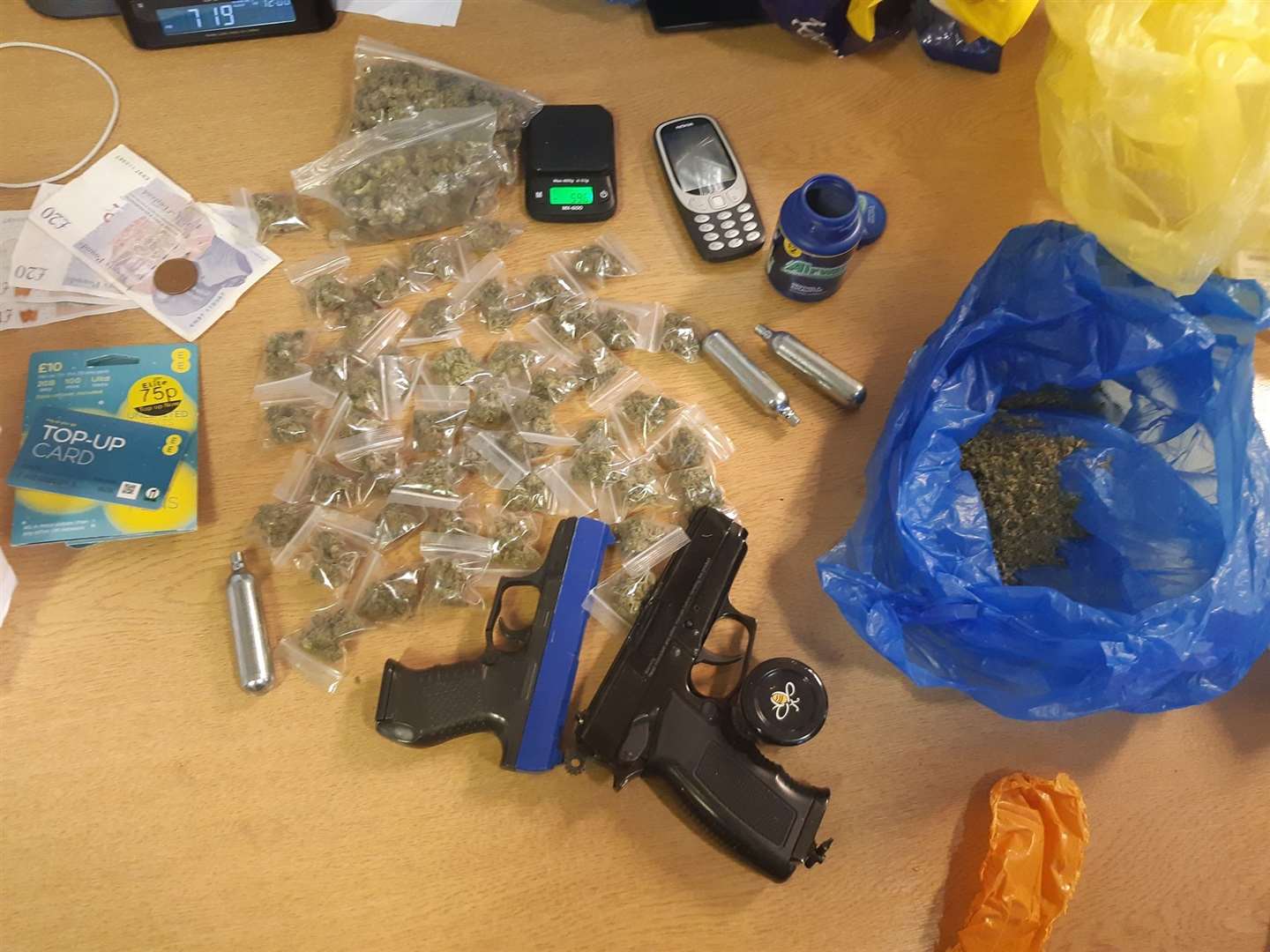 Police recovered drugs and two BB guns. (28157542)