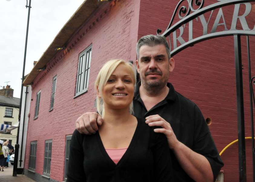TREE ROW: Sean Portass, with partner Dana Garkavaya, outside one of his pubs in Long Sutton. Photo (TIM WILSON): SG220515-107TW.