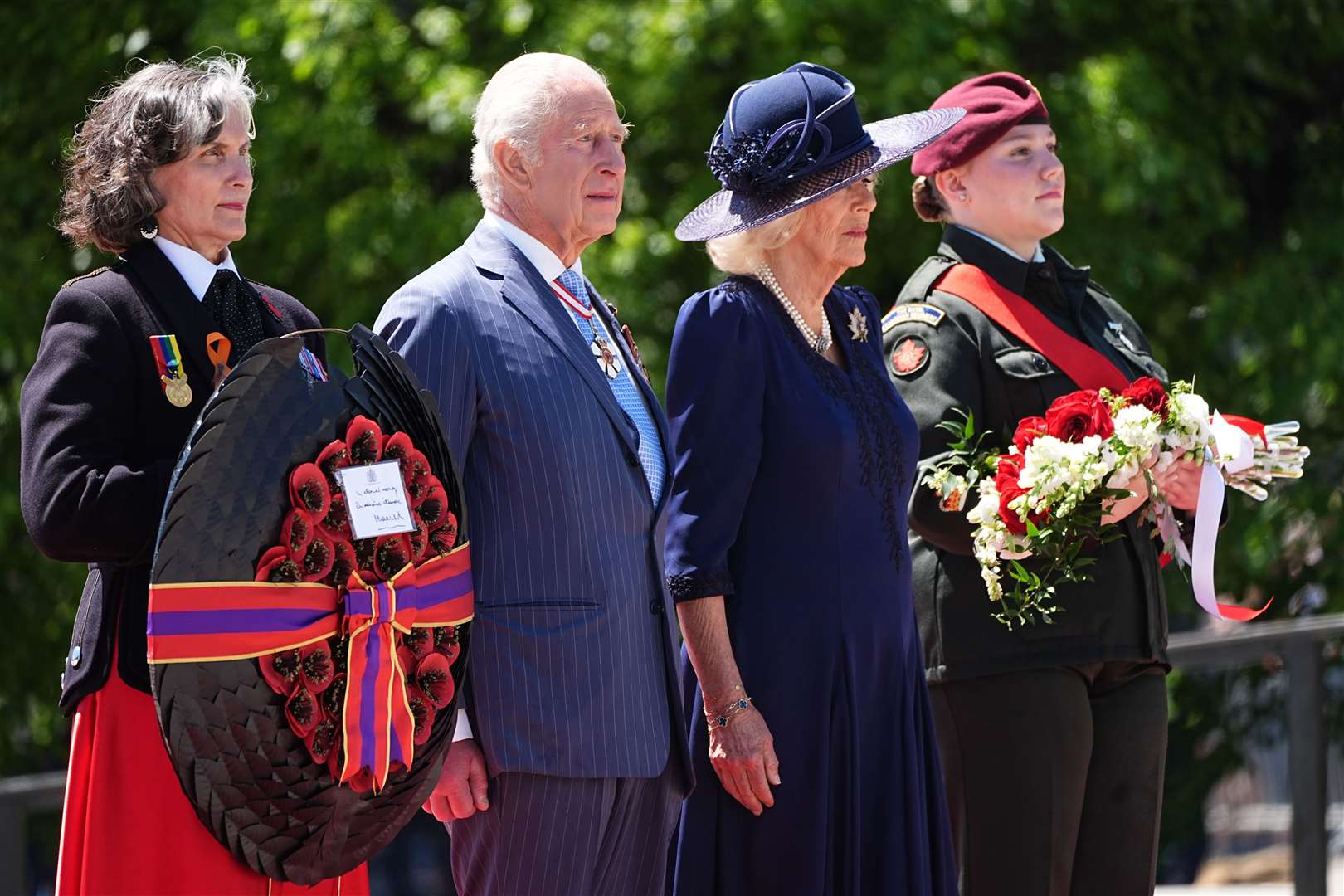 The King and Queen left floral tributes at the Tomb of the Unknown Soldier in front of the National War Memorial, Ottawa (Aaron Chown/PA)