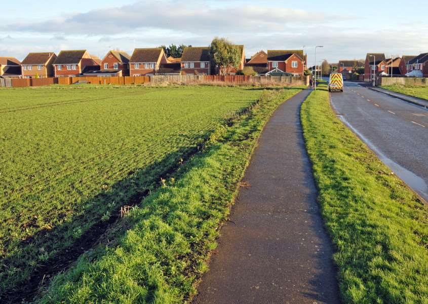 Development land on Harvester Way, Crowland, looking towards existing housing. Photo by Tim Wilson.