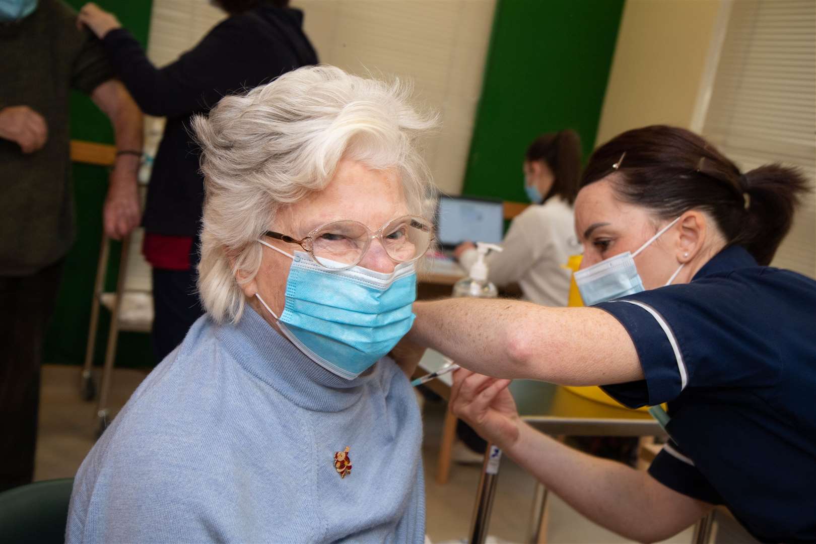 Woman having vaccine.