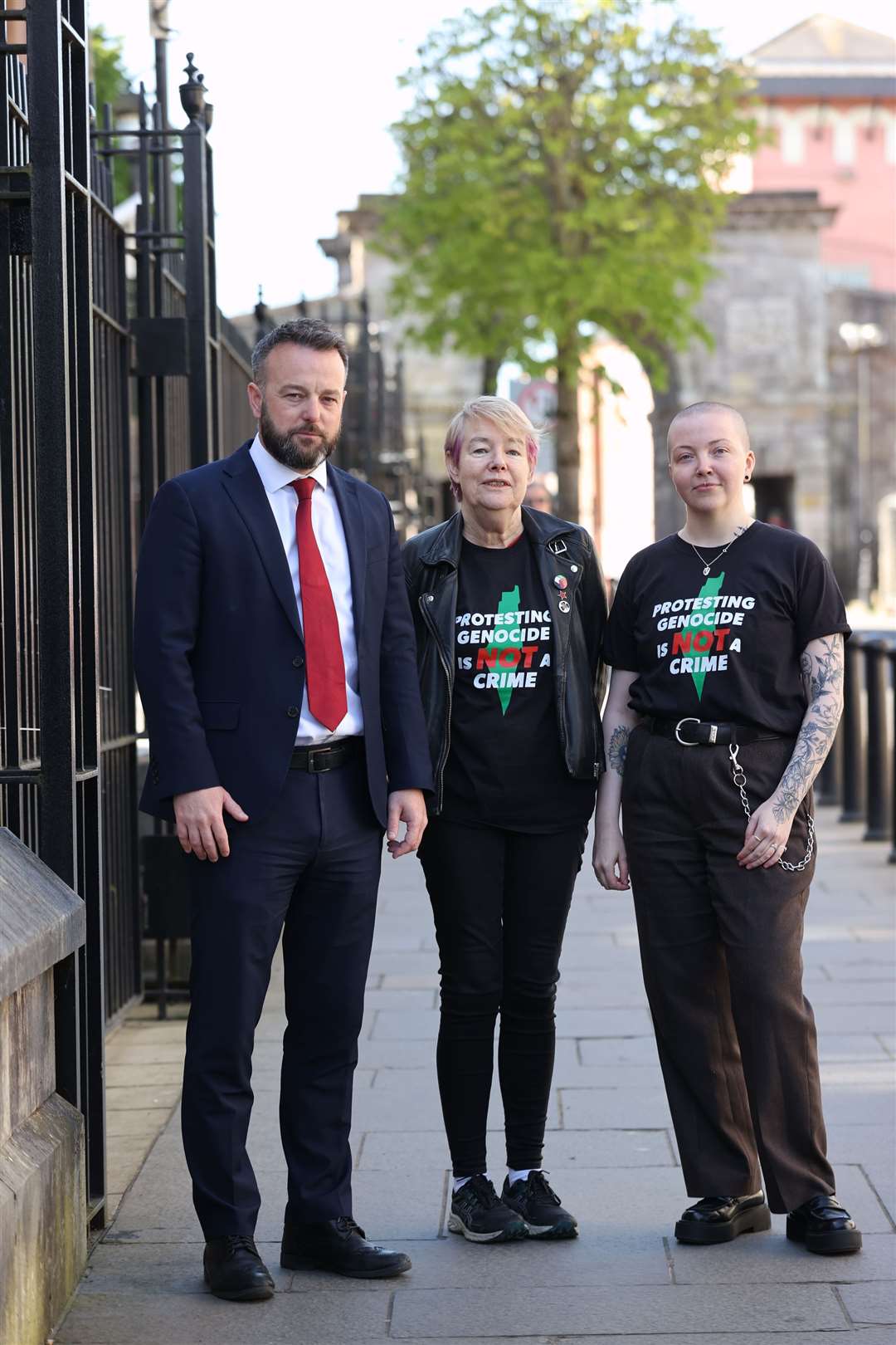 Former SDLP leader Colum Eastwood (left) with co-accused Goretti Horgan (centre) and Davina Pulis outside Derry Magistrates’ Court (Liam McBurney/PA)