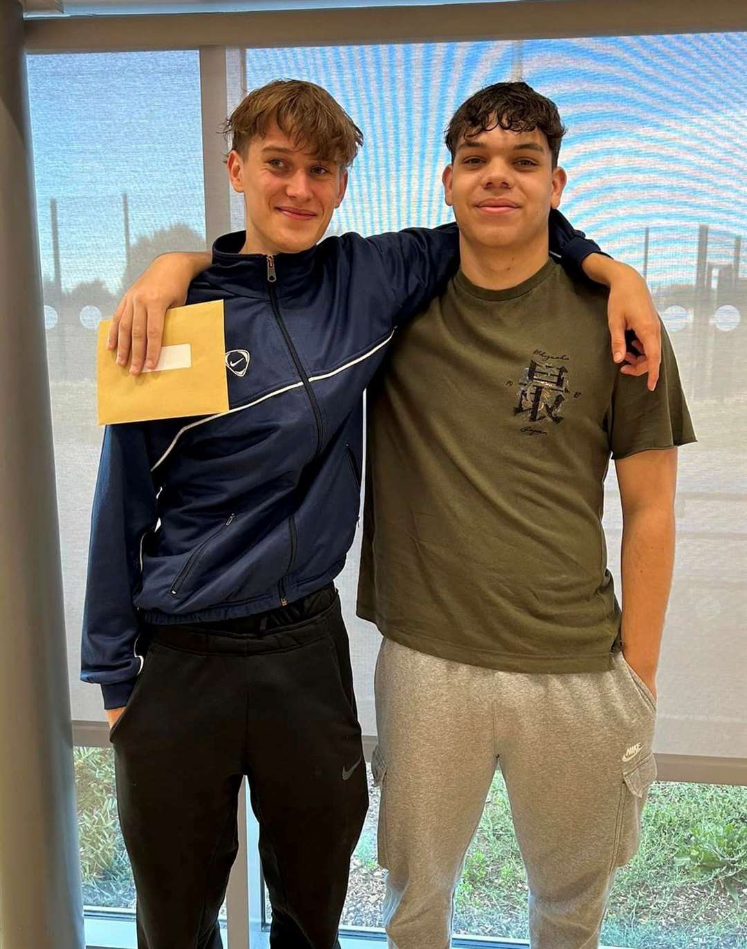 Two Cromwell students with their results.