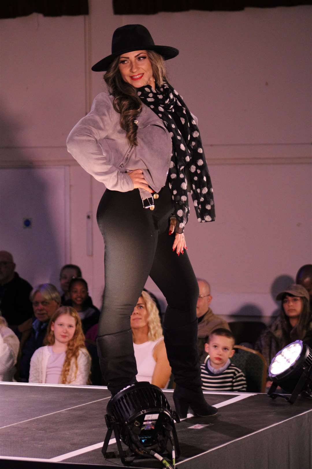 A model in a glamorous outfit made up of items from the Donations Hub